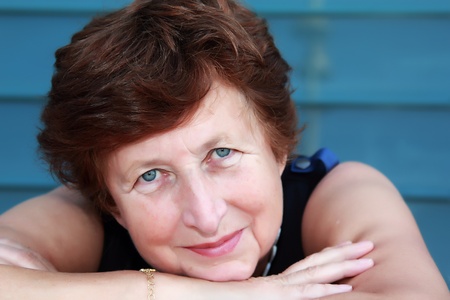 Portrait of 65-years-old beautiful woman outdoorsの写真素材