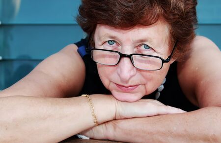 Portrait of 65-years-old beautiful woman outdoorsの写真素材