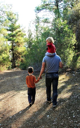 Father with two kids outdoorsの写真素材