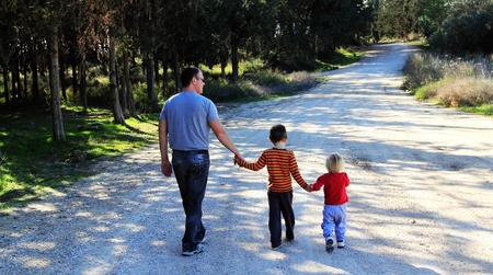 Father with two kids outdoorsの写真素材