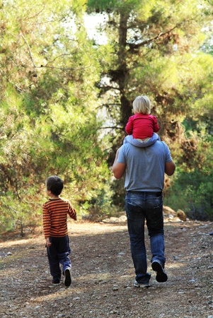 Father with two kids outdoorsの写真素材