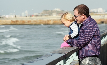 father and daughter on vacation at seaの写真素材
