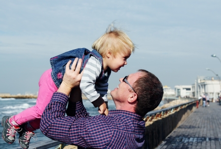father and daughter on vacation at seaの写真素材