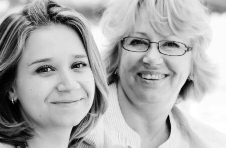 Mother and daughter on vacation at sea  Focus on young woman  