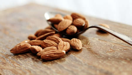 almonds on wooden backgroundの写真素材