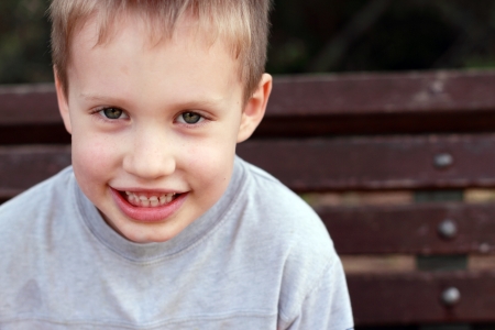 Outdoors portrait of cute 5 years old child boy の写真素材