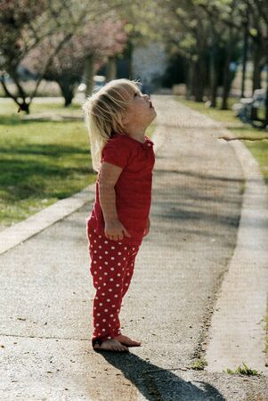 cute little girl outdoors. Photo in old image styleの写真素材