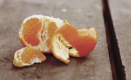 tangerines on a natural wooden tableの写真素材