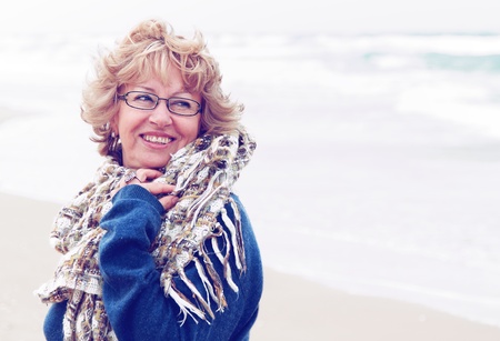 Portrait of happy senior woman at sea