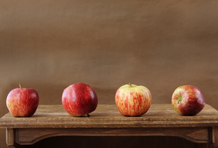 Fresh apples on wooden tableの写真素材