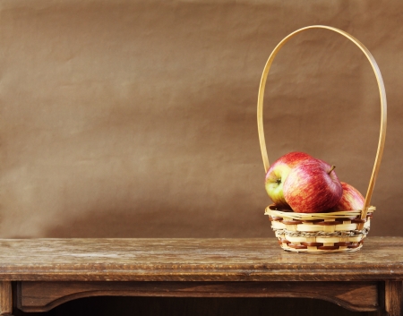 Fresh apples on wooden tableの写真素材