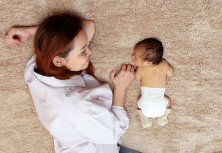 young mother with her newborn babyの写真素材