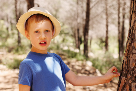 Outdoors portrait of cute 6 years old child boyの写真素材