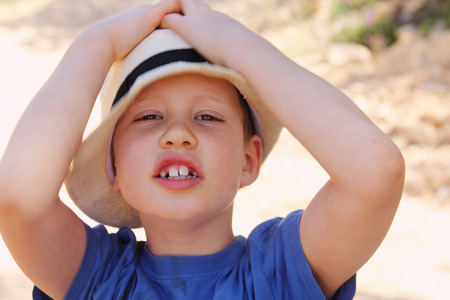 Outdoors portrait of cute 6 years old boy