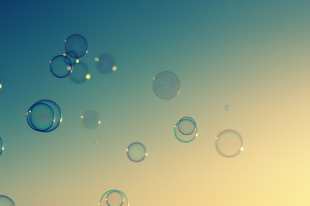 Soap bubbles floating in the air as the Summer sunsets