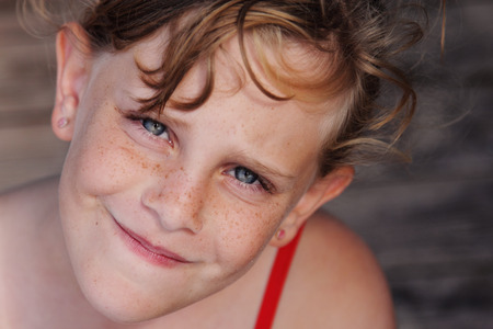 outdoors portrait of freckled cute girlの写真素材