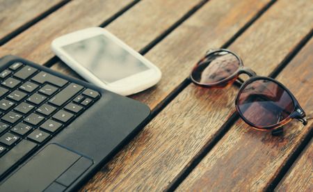 laptop with smart phone on tableの写真素材