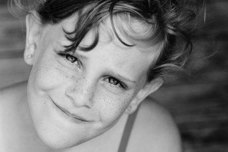 outdoors portrait of freckled cute girlの写真素材