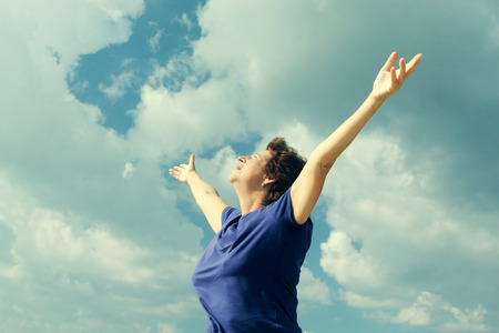 Senior caucasian woman relaxing on the beachの写真素材