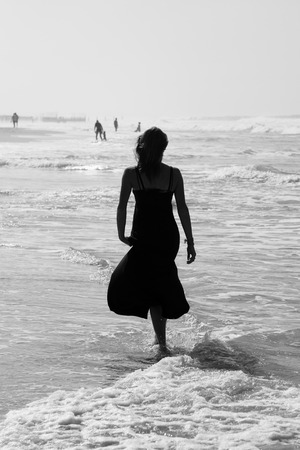 Beautiful young woman at the beachの写真素材