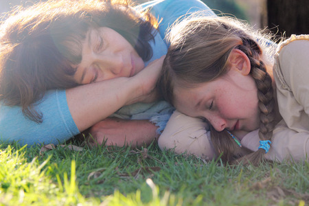 Portrait mother and daughter outdoorsの写真素材