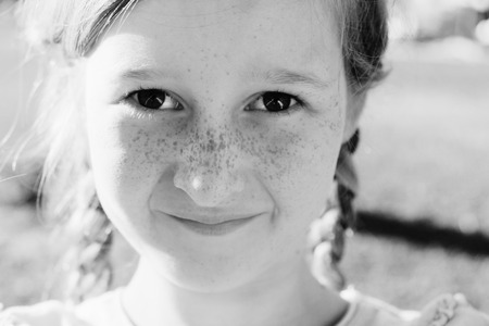 portrait of a beautiful happy smiling girl outdoorsの写真素材