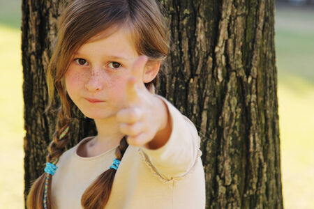 portrait of a beautiful happy smiling girl outdoorsの写真素材