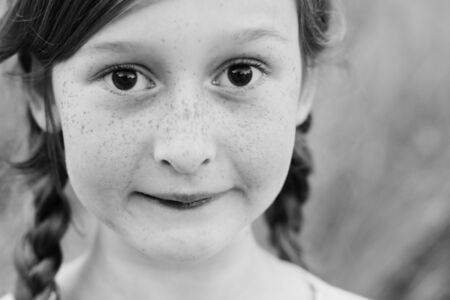 portrait of a beautiful happy smiling girl outdoorsの写真素材