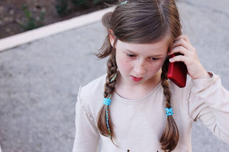 beautiful happy girl tslking on the phoneの写真素材
