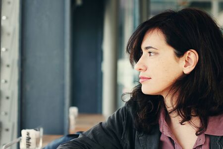 Portrait of the beautiful woman sitting in the cafeの写真素材
