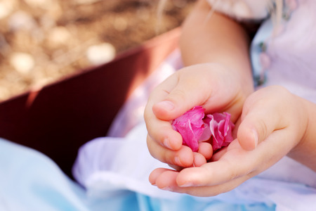 Little Girl Holding Flower