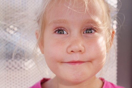 Portrait of funny lovely little girlの写真素材