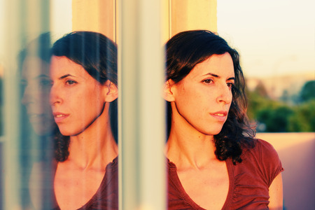 Portrait of beautiful 35 years old woman on sunset colorsの写真素材