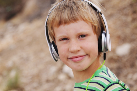 Portrait of cute autistic boy with headphonesの写真素材