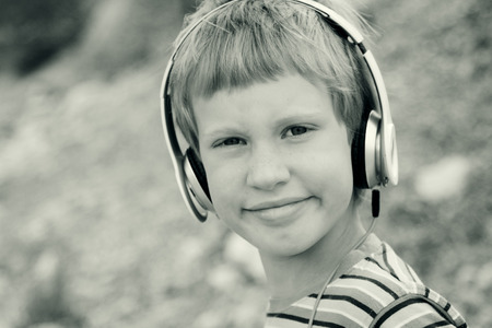 Portrait of cute autistic boy with headphonesの写真素材
