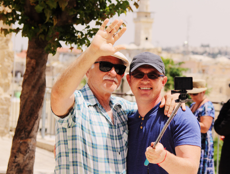 father and  adult son spending time togetherの写真素材