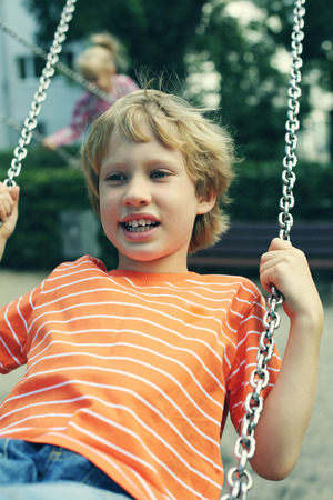 portrait of happy 7 years boy outdoorsの写真素材