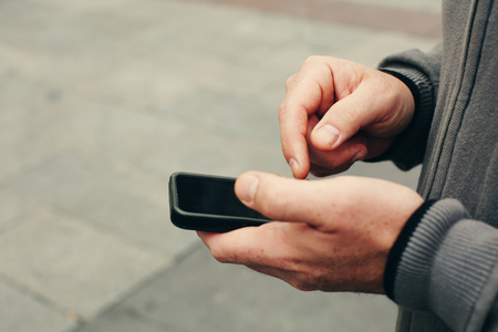 Handsome man holding smartphoneの写真素材