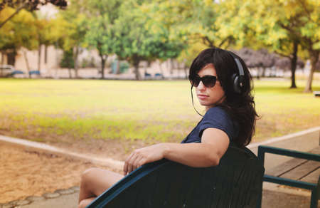 Beautiful Woman with Headphones Outdoorsの写真素材