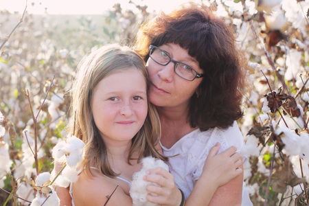 Portrait of mother and daughter outdoorsの写真素材