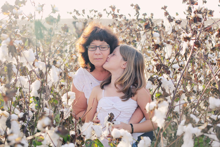 Portrait of mother and daughter outdoorsの写真素材