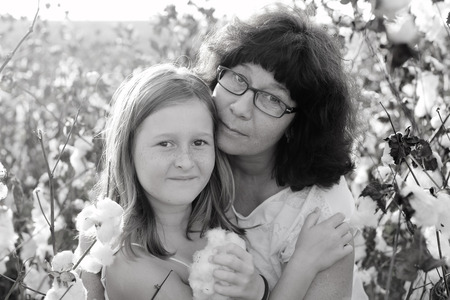 Portrait of mother and daughter outdoorsの写真素材