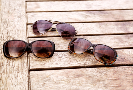 sunglasses on the wooden tableの写真素材