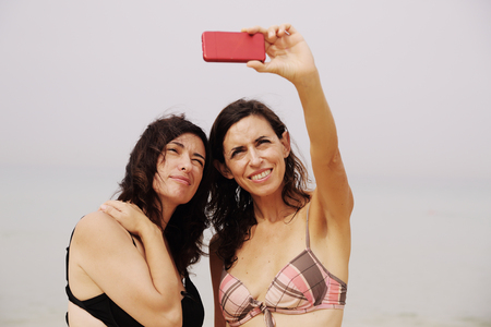 two best friends making selfie photoの写真素材