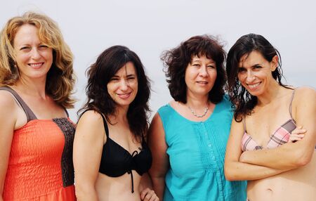 four best girlfriends making selfie-photo at seasideの写真素材