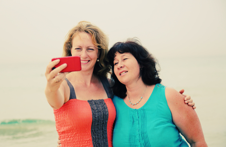 two best friends making selfie photoの写真素材