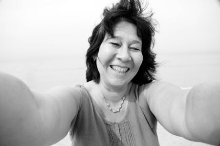 selfie portrait of 45 years woman outdoorsの写真素材