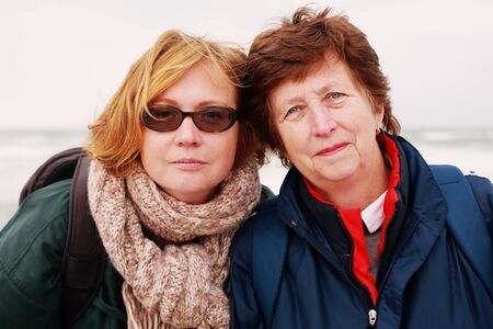 Portrait of beautiful senior woman and her adult daughterの写真素材