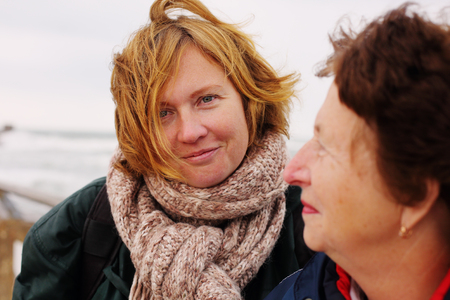 Portrait of beautiful senior woman and her adult daughterの写真素材