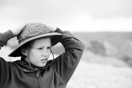 Cute 8 years old boy hiking in desertの写真素材